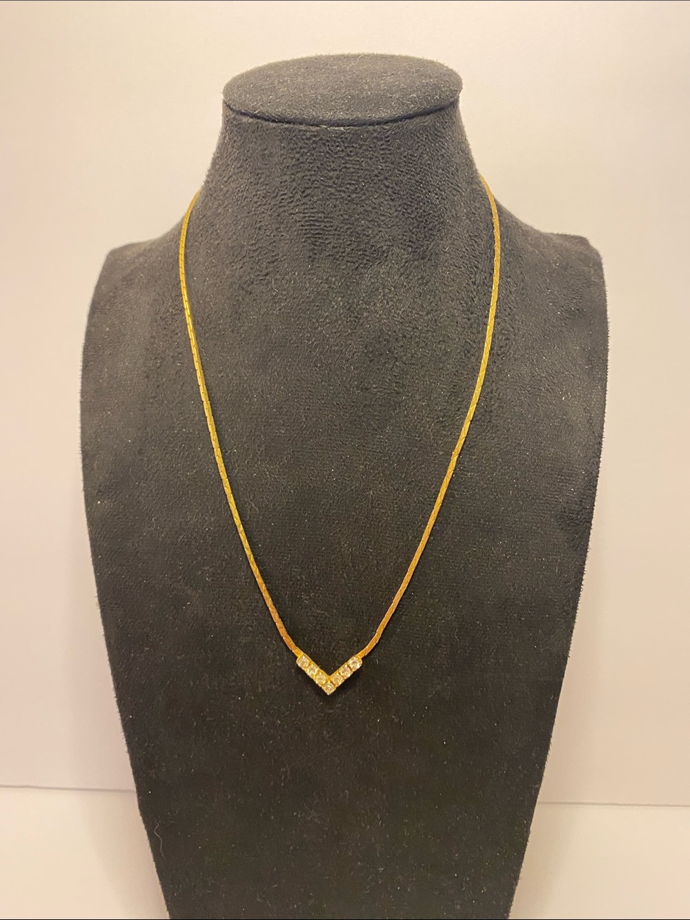 Gold color necklace with stones